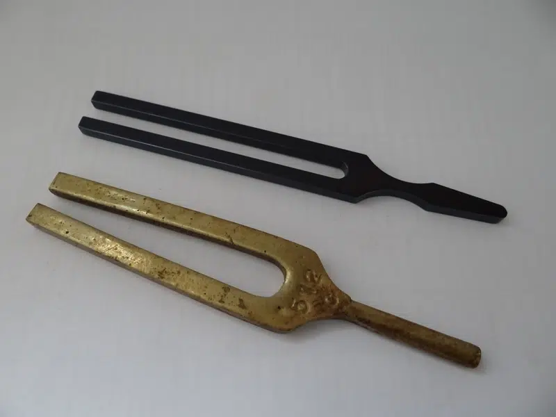 How Does a Tuning Fork Produce Sound Waves?